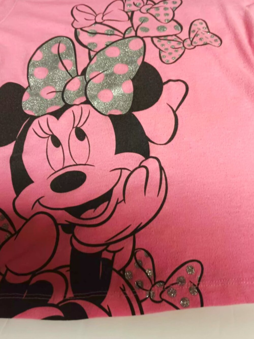 Disney Minnie Mouse short sleeve 6-6X pink graphic Tee with Glitter bow detail.